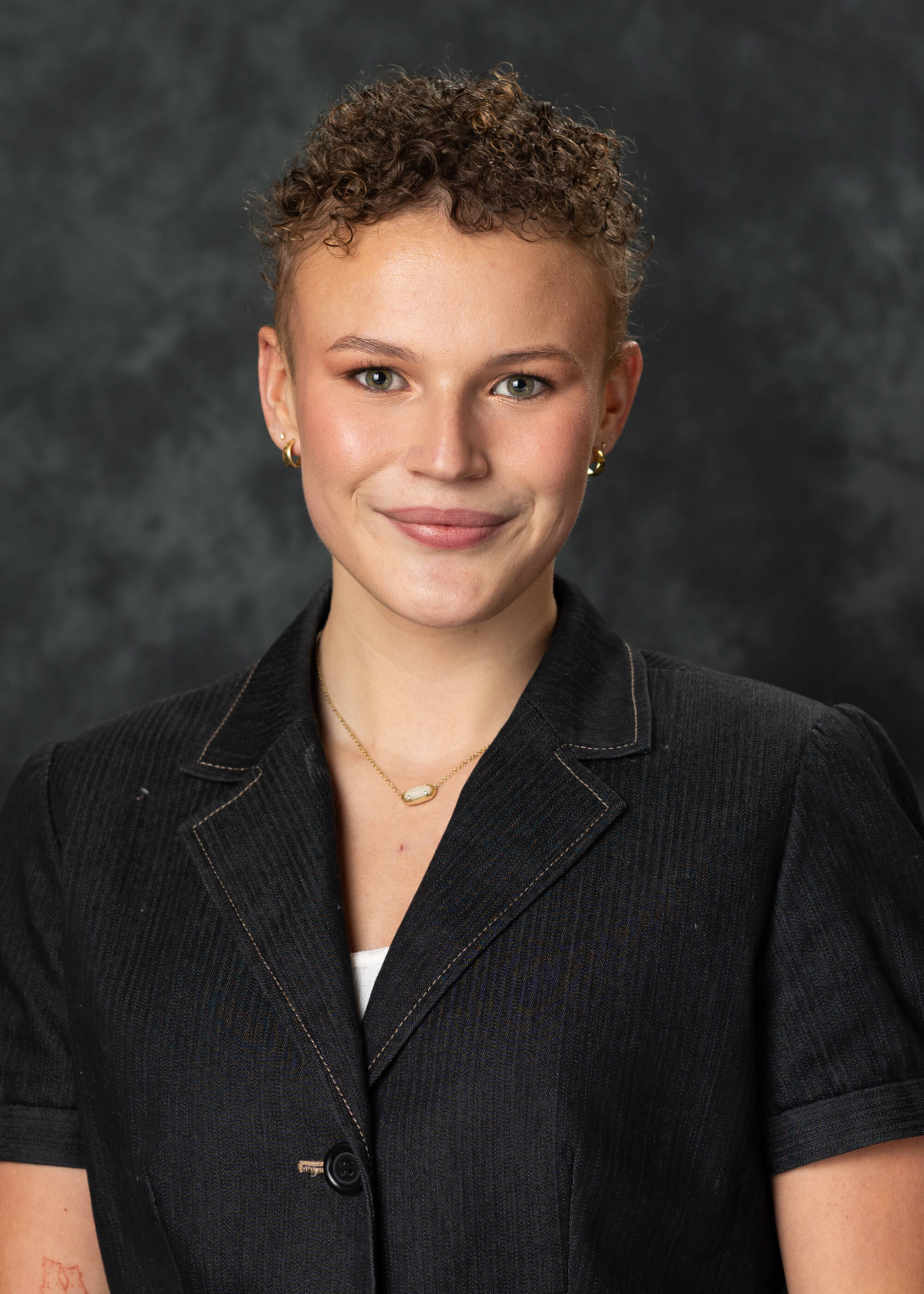 Emily Almas in a black top